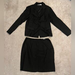 Women's black pinstripe suit. Excellent condition. Pet-free, smoke-free home.